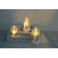 Vánoční LED svíčka Nikolao I 7,5x15 cm bílá