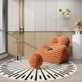 Designové křeslo Nua s podnožkou béžové/červené